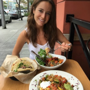 Jackie eating Mexican food from Sharky's Mexican Grill